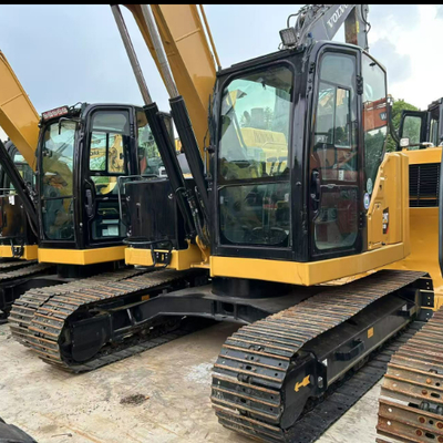 حفارة دوارة هيدروليكية مستعملة من كاتربيلر CAT 310 مستعملة للتعامل مع الأخشاب